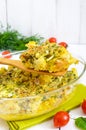 Baked cauliflower with cheese and egg in a glass form on a white wooden background Royalty Free Stock Photo