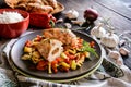 Baked chicken breast stuffed with cheese, tomato and basil with rice and steamed vegetable salad