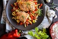 Baked chicken breast stuffed with cheese, tomato and basil with rice and steamed vegetable salad