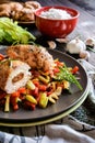 Baked chicken breast stuffed with cheese, tomato and basil with rice and steamed vegetable salad Royalty Free Stock Photo