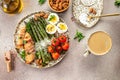 Baked chicken breast wrapped in bacon with asparagus, eggs and cherry tomato, Healthy fats, clean eating for weight loss. Keto Royalty Free Stock Photo