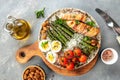 Baked chicken breast wrapped in bacon with asparagus, eggs and cherry tomato, Healthy fats, clean eating for weight loss. Keto Royalty Free Stock Photo