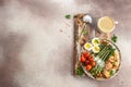 Baked chicken breast wrapped in bacon with asparagus, eggs and tomatoes. Ketogenic diet. Low carb high fat breakfast. Healthy food Royalty Free Stock Photo