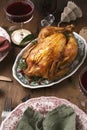 baked chicken in Christmas dekor with candles and serving Royalty Free Stock Photo