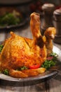 Baked chicken leg, served with roasted potatoes and vegetables Royalty Free Stock Photo