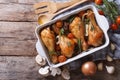 Baked chicken legs with mushrooms and vegetables. horizontal top Royalty Free Stock Photo