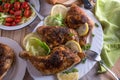 Baked chicken legs with salad on a dinner table Royalty Free Stock Photo