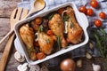 Baked chicken legs with vegetables close-up horizontal top view Royalty Free Stock Photo