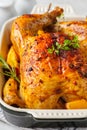 Baked chicken with spices, cranberries, orange and onions in a glass dish Royalty Free Stock Photo