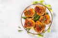 Baked chicken thighs with herbs on white plate. Royalty Free Stock Photo