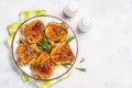 Baked chicken thighs with herbs on white plate. Royalty Free Stock Photo