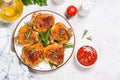 Baked chicken thighs with herbs on white plate. Royalty Free Stock Photo