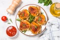 Baked chicken thighs with herbs on white plate. Royalty Free Stock Photo