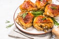 Baked chicken thighs with herbs on white plate. Royalty Free Stock Photo