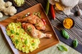 Baked chicken thighs with honey, grated ginger and rice with turmeric Royalty Free Stock Photo