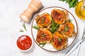 Baked chicken thighs with herbs on white plate. Royalty Free Stock Photo