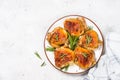 Baked chicken thighs with herbs on white plate. Royalty Free Stock Photo