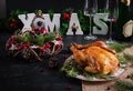 Baked chicken or turkey. The Christmas table is served with turkey, decorated with bright tinsel. Royalty Free Stock Photo