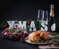 Baked chicken or turkey. The Christmas table is served with turkey, decorated with bright tinsel. Royalty Free Stock Photo