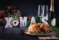 Baked chicken or turkey. The Christmas table is served with turkey, decorated with bright tinsel. Royalty Free Stock Photo