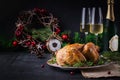 Baked chicken or turkey. The Christmas table is served with turkey, decorated with bright tinsel. Royalty Free Stock Photo