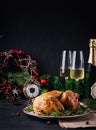 Baked chicken or turkey. The Christmas table is served with turkey, decorated with bright tinsel. Royalty Free Stock Photo