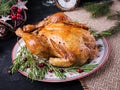 Baked chicken or turkey. The Christmas table is served with turkey, decorated with bright tinsel. Royalty Free Stock Photo