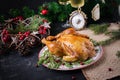 Baked chicken or turkey. The Christmas table is served with turkey, decorated with bright tinsel. Royalty Free Stock Photo