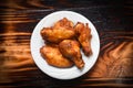 Baked chicken wing bbq grill on plate / hot and spicy chicken on dark background Royalty Free Stock Photo