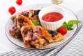 Baked chicken wings in the Asian style and tomatoes sauce on plateBaked chicken wings in the Asian style and tomatoes sauce Royalty Free Stock Photo