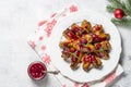 Baked chicken wings in cranberry sauce.