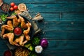 Baked chicken wings in a pan with ketchup and onions. Barbecue. Top view. Royalty Free Stock Photo