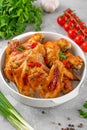 Baked chicken wings served with sweet chili sauce and fresh herbs. Selective focus Royalty Free Stock Photo