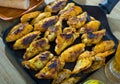 Baked chicken wings with sauce on frying pan Royalty Free Stock Photo