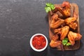 Baked chicken wings on wooden board Royalty Free Stock Photo