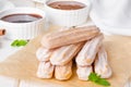 Baked churros with cinnamon, powdered sugar, chocolate and caramel sauce.