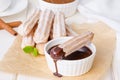 Baked churros with cinnamon, powdered sugar, chocolate and caramel sauce.