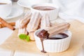 Baked churros with cinnamon, powdered sugar, chocolate and caramel sauce.