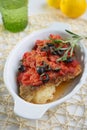 Baked cod under tomato sauce Royalty Free Stock Photo