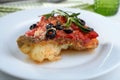 Baked cod under tomato sauce Royalty Free Stock Photo