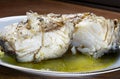 Baked cod on a white dish Royalty Free Stock Photo