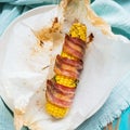 Baked corn with crispy bacon and herbs Royalty Free Stock Photo