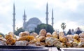 Baked corn on a street vendor cart in the historical center of Istanbul, Turkey with a blue mosque in the background Royalty Free Stock Photo