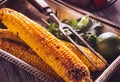 Baked corn in vintage tray with lime