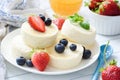 Baked cottage cheese cheesecake or syrniki with berry fruits. Healthy summer dessert