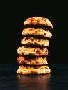 Baked cottage cheese and oatmeal cookies with raisins. Healthy nutrition, diet food. Stack on a black background Royalty Free Stock Photo