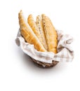 Baked croissant in basket. Crispy bun roll isolated on white background Royalty Free Stock Photo