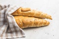 Baked croissant. Crispy bun roll on white table Royalty Free Stock Photo