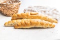 Baked croissant. Crispy bun roll on white table Royalty Free Stock Photo