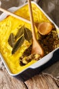 Baked curry beef mince covered omelette South African traditional food Bobotie close-up on the table. vertical